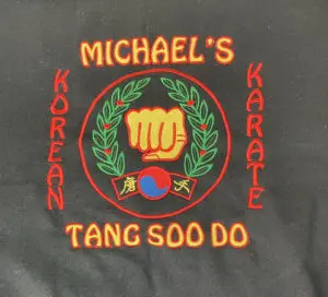 A close up of the name of a martial arts instructor