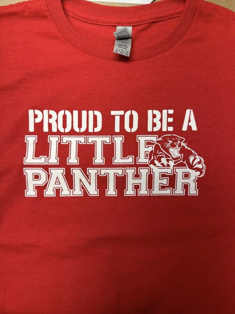 A red shirt that says proud to be a little panther.